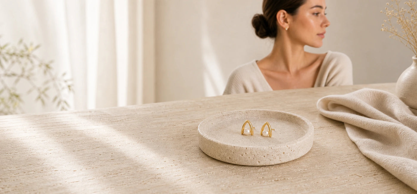 Real earrings, quietly styled.